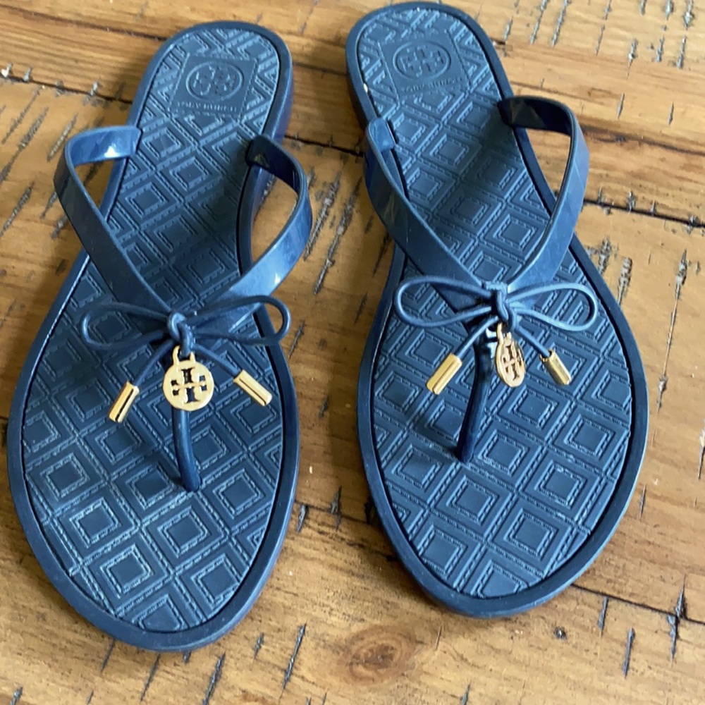Tory Burch Navy rubber flip flops w/ gold accents.